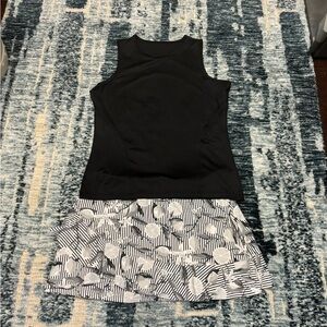 Tail Tennis wear. Black and White combos. Size L in excellent to great shape